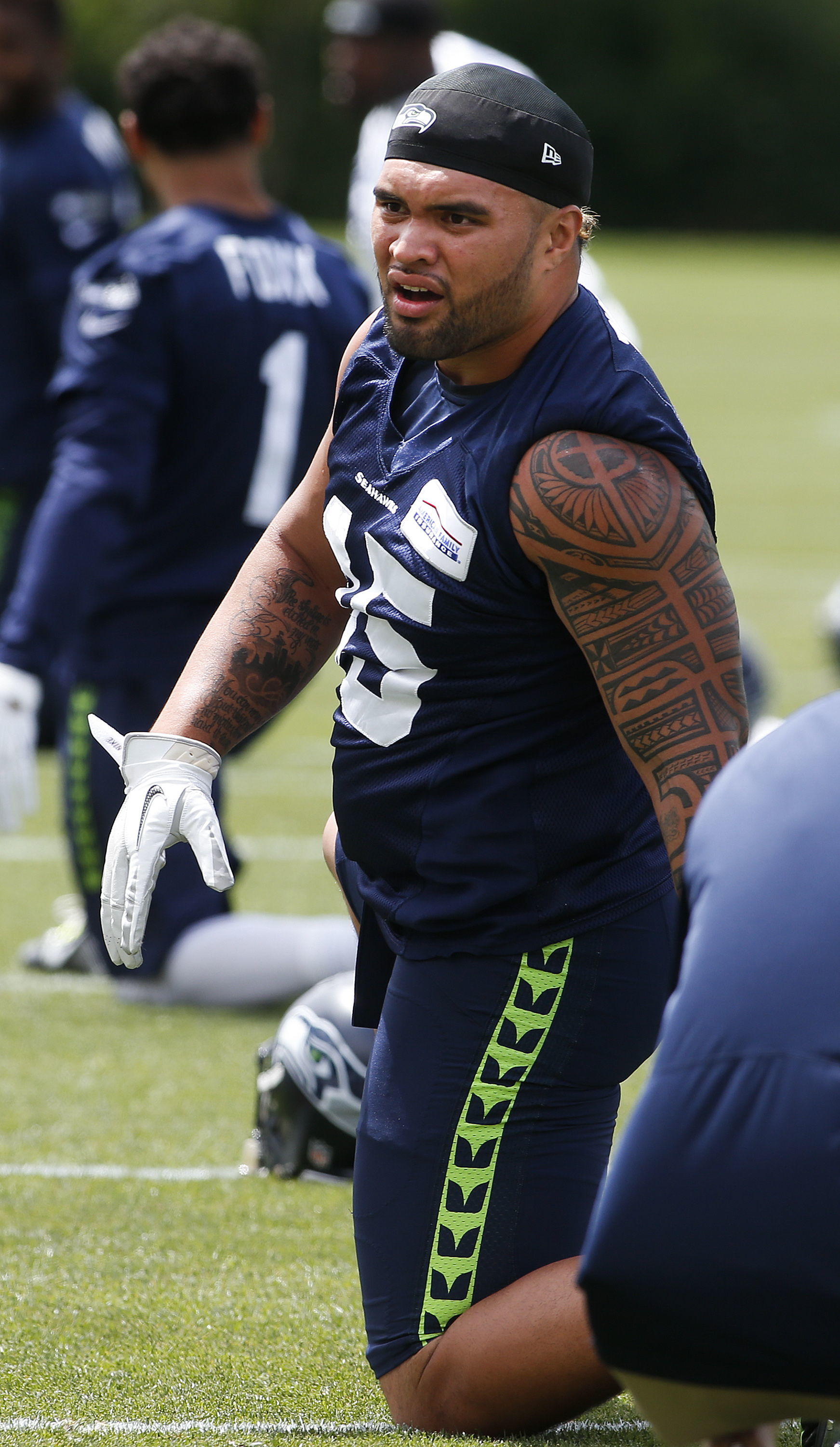 The Seahawks’ Taniela Tupou, an Archbishop Murphy alum, stretches during a minicamp practice June 14 at the Virginia Mason Athletic Center in Renton.