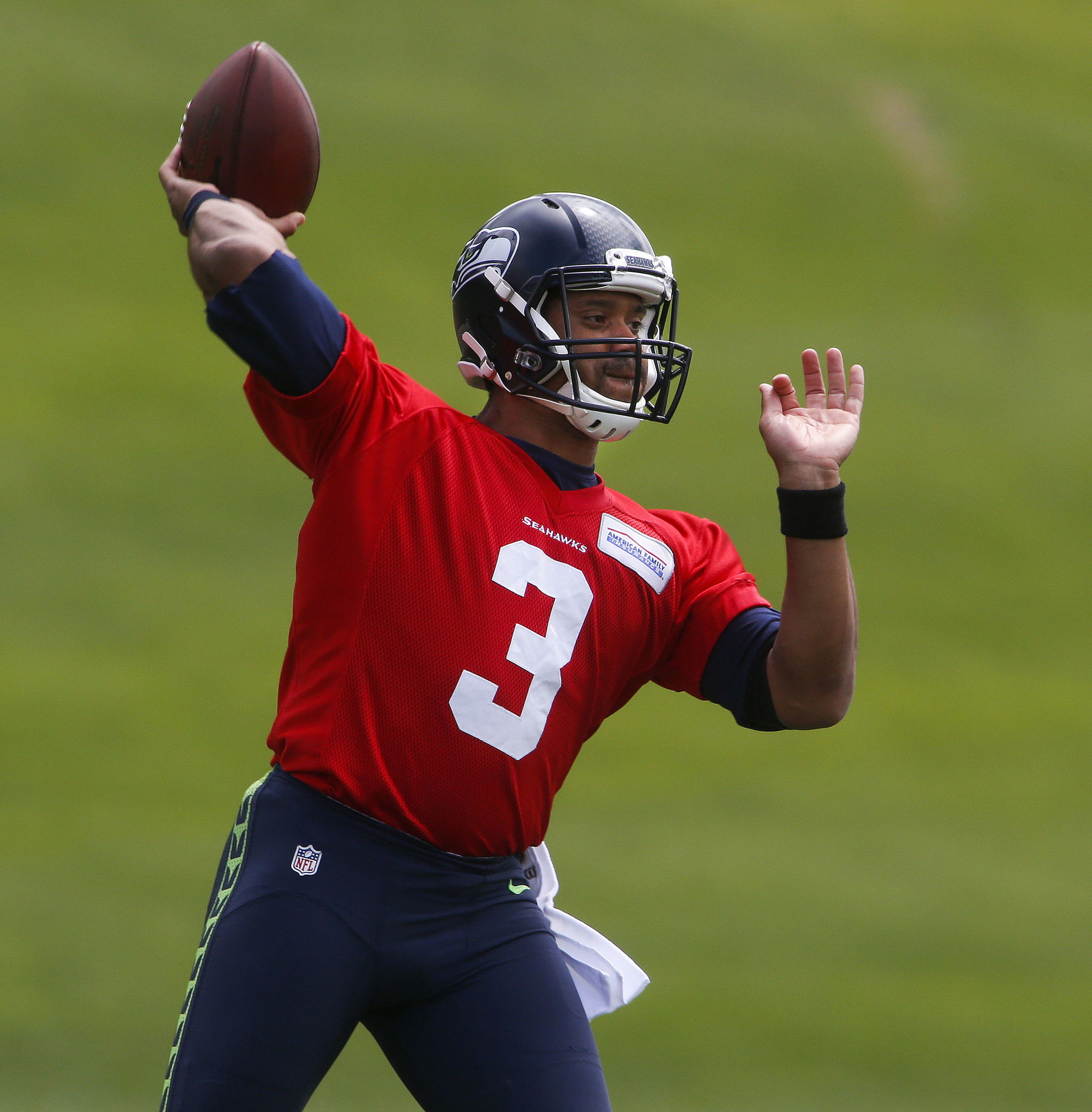 Seahawks quarterback Russell Wilson throws during a minicamp practice Tuesday at the Virginia Mason Athletic Center in Renton.
