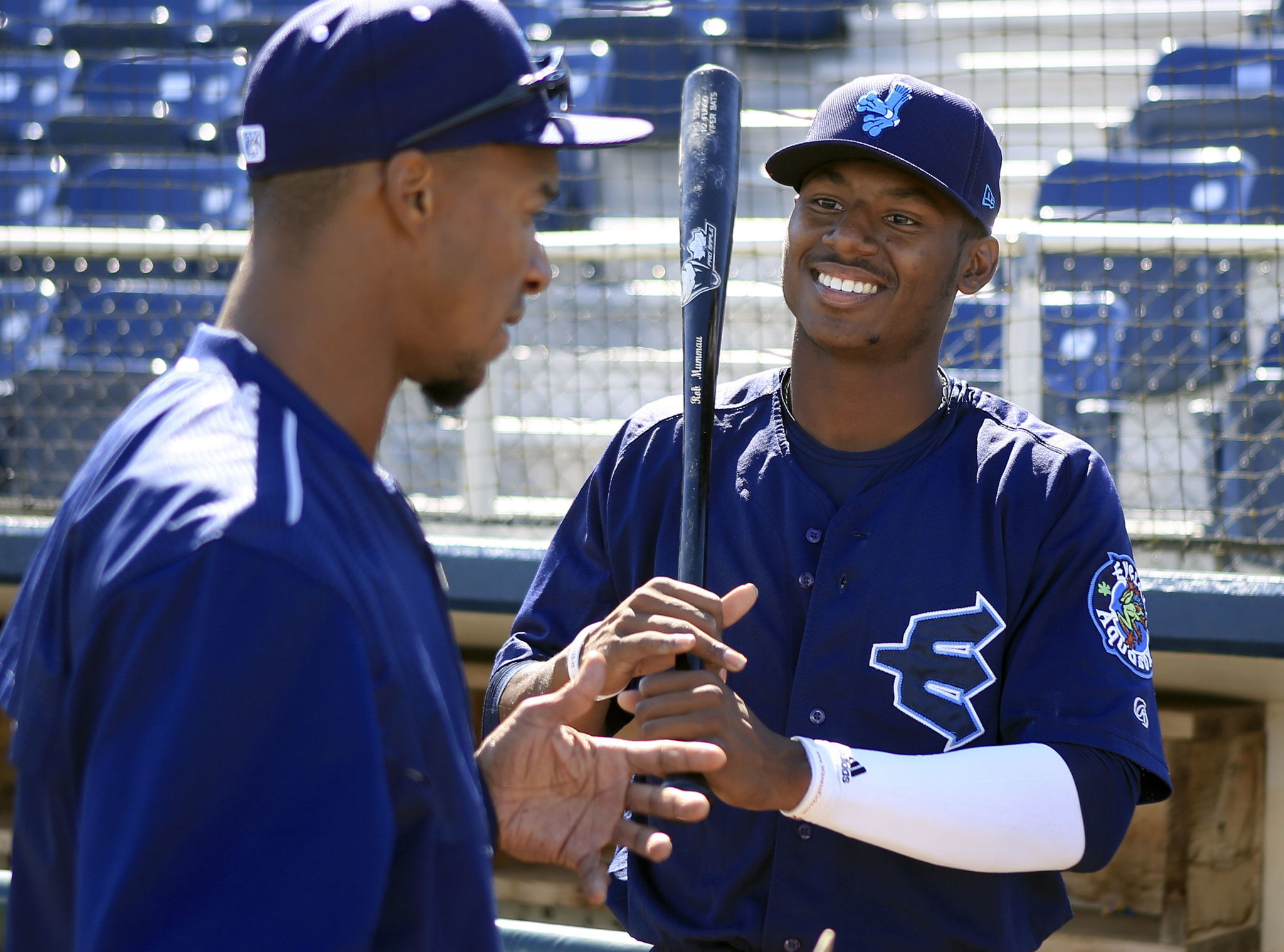 Kyle Lewis (right) talks with Everett Aquasox hitting coach Brian Hunter during a workout last week at Everett Memorial Stadium.