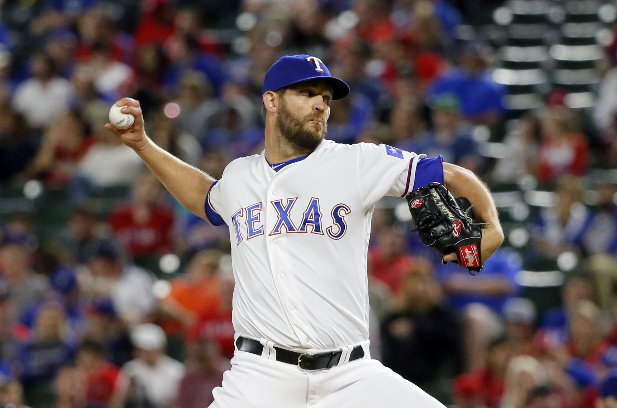 Tom Wilhelmsen, shown here pitching for the Texas Rangers in April, was traded back to the Seattle Mariners on Tuesday for a player to be named or cash. Wilhelmsen started his career with the Mariners.