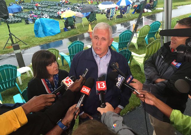 In this July 3 photo, Indiana Gov. Mike Pence speaks during a news conference before attending Symphony on the Prairie for a Fourth of July concert in Fishers, Indiana. Pence is one of several Republicans Trump is considering for his vice presidential running mate. (AP Photo/Michael Conroy, File)