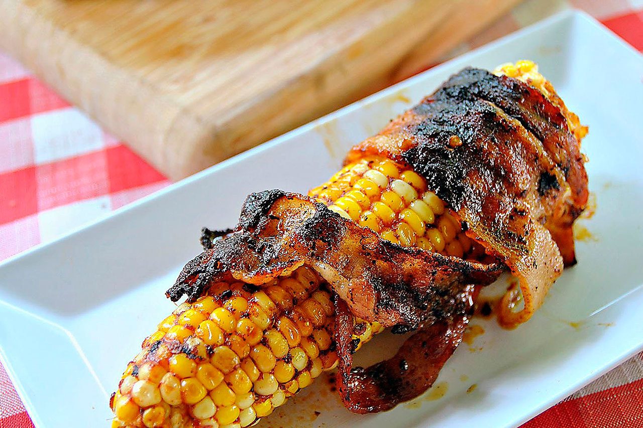 Bacon-wrapped corn with chipotle glaze provides yet more proof that everything’s better with bacon. (Gretchen McKay/Pittsburgh Post-Gazette)