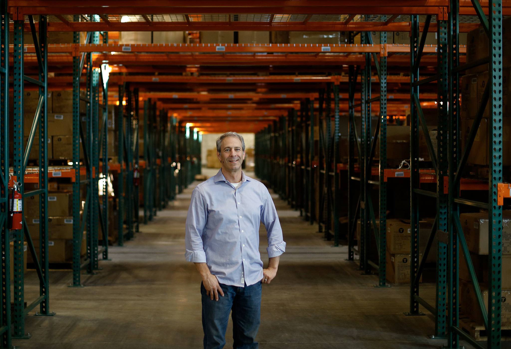 Jack Wolfin, president of Triple T Trading, which owns Northside, stands inside his company’s new warehouse in Marysville. (Andy Bronson / The Herald)