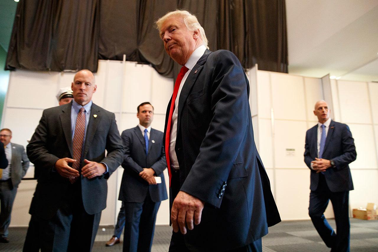 Republican presidential candidate Donald Trump walks away after speaking to reporters before a town hall event Monday in Columbus, Ohio. (AP Photo/Evan Vucci)