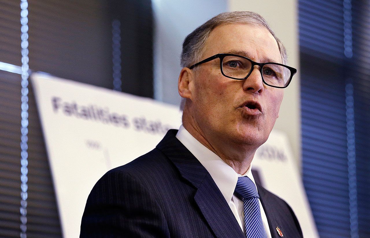 Gov. Jay Inslee speaks at a news conference in Burien in January. (AP Photo/Elaine Thompson)