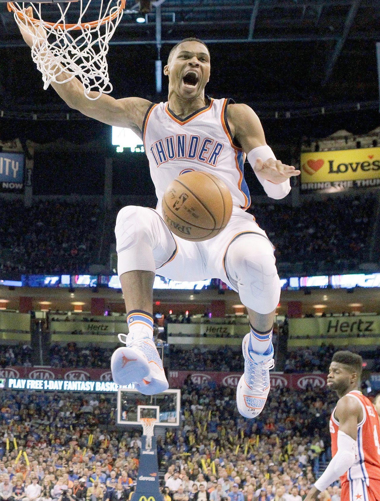 Oklahoma City’s Russell Westbrook celebrates after a dunk against Philadelphia on Nov. 13. Westbrook signed a three-year extension to stay in Oklahoma City on Thursday, a deal that is reportedly worth $85.7 million. (AP Photo/Sue Ogrocki)