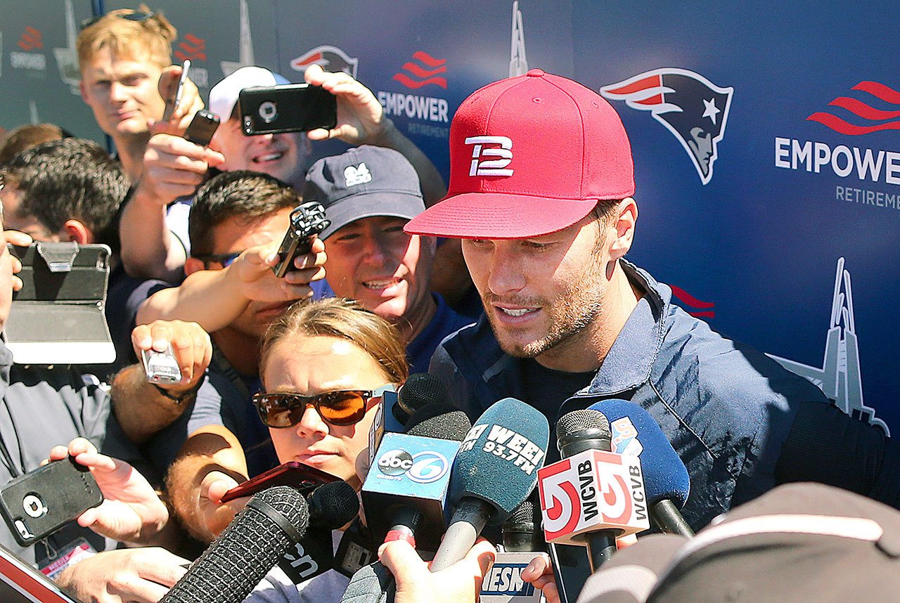 New England’s Tom Brady speaks to media at Patriots training camp Friday in Foxborough, Mass., for the first time after deciding not to pursue further appeals of his four-game suspension stemming from the “Deflategate” scandal. (John Tlumacki/Boston Globe via AP)