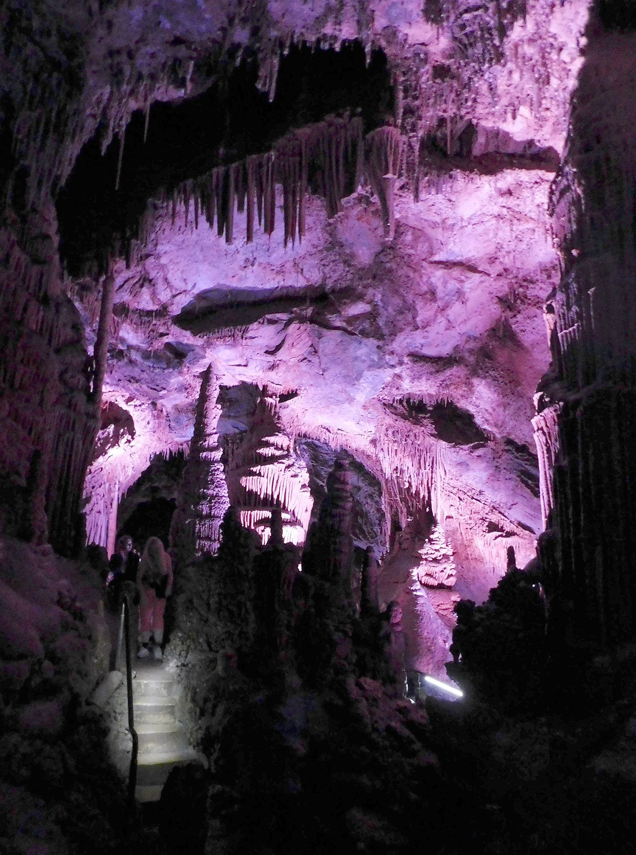 Pink limestone gives an otherworldly look to parts of the cave at Lewis & Clark Caverns​ ​State Park in southwest Montana. While most limestone is gray, certain chemical conditions will cause​ ​them to exhibit different colors. (Photo by Doug Parry)