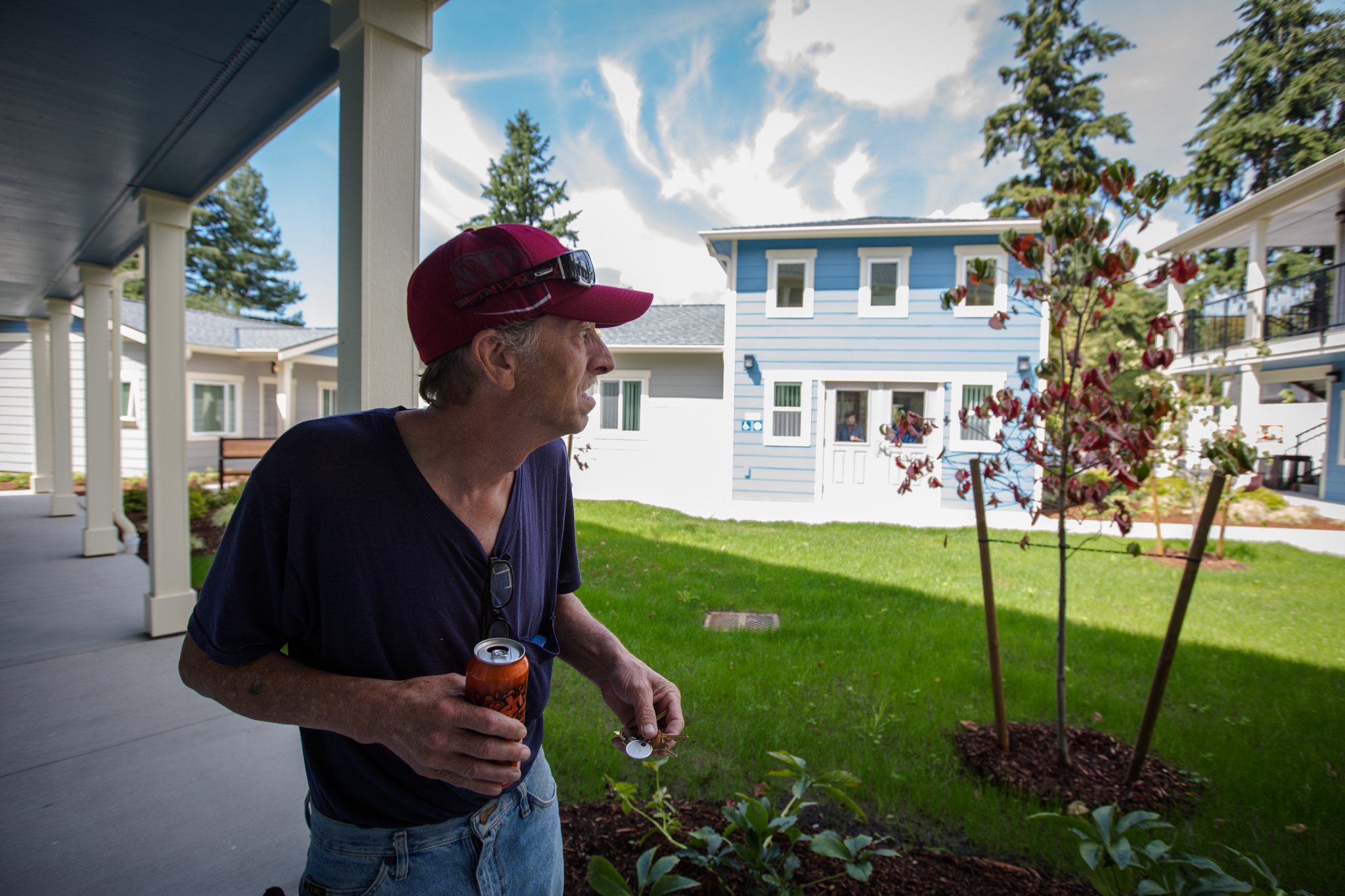 Ricky Kyles takes a walk around Sebastian Place, the new facility for chronically homeless veterans in Snohomish County, on Aug. 8 in Everett. Kyles has been living there for just a week but spends a lot of time with the other residents, who gather to talk and connect. (Daniella Beccaria / For The Herald)