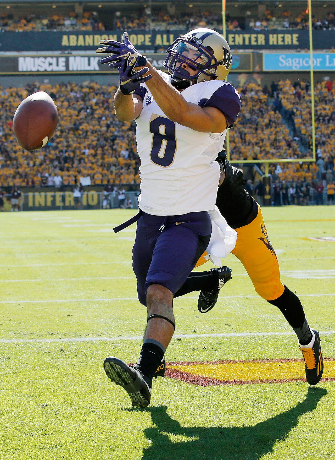 Washington’s Dante Pettis (8) is unable to make a catch against Arizona State last season in Tempe, Ariz. Pettis and the Huskies are enjoying the new, safer football helmets they will be wearing this season. (AP Photo/Ross D. Franklin)
