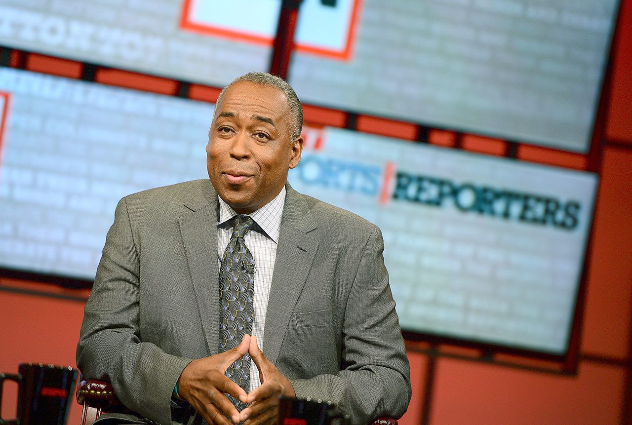 John Saunders poses on the set of “The Sports Reporters” in Bristol, Conn. in 2013. Saunders died on Wednesday at the age of 61. (Joe Faraoni/ESPN Images via AP)