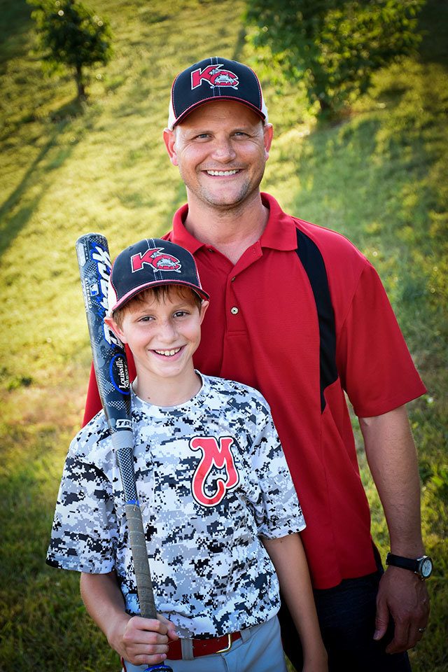 This June 2016 photo provided by David Strickland shows Caleb Thomas Schwab posing with his father Scott Schwab, a Kansas state lawmaker from Olathe. Caleb died Sunday while riding the Verruckt, a water slide that’s billed as the world’s largest, at the Schlitterbahn Waterpark in Kansas City, Kansas. (David Strickland/David Strickland via AP)