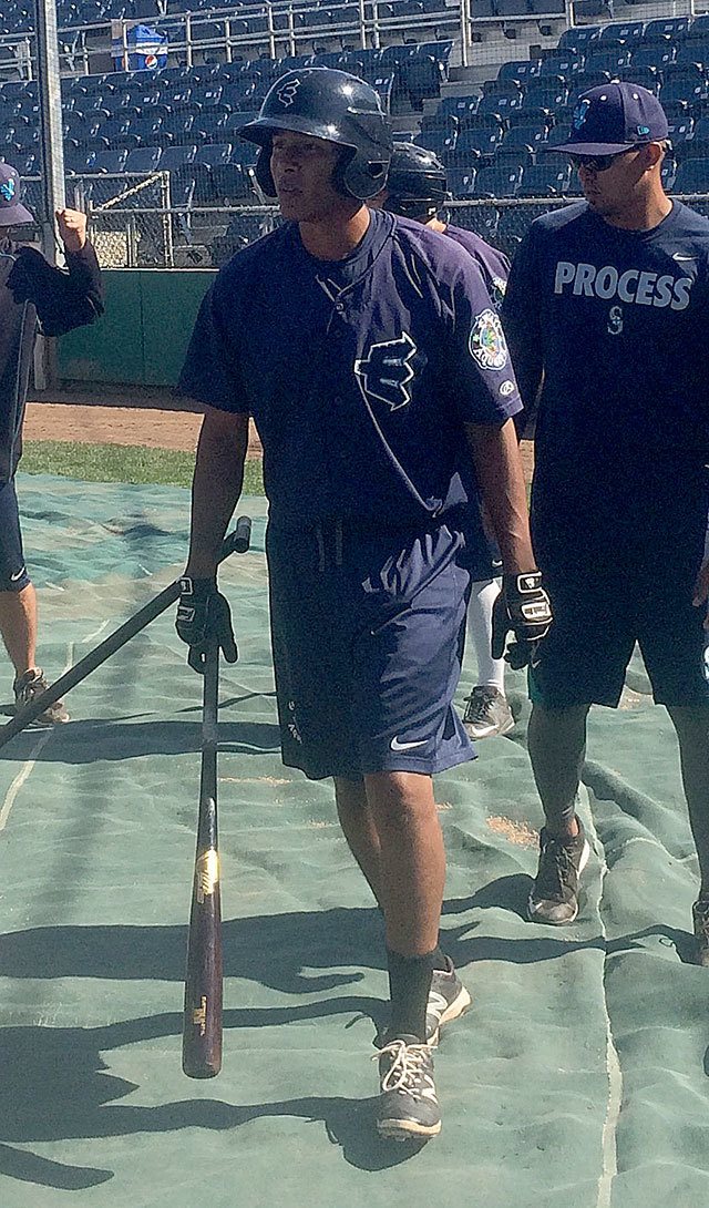 Everett AquaSox outfielder Dimas Ojeda (center) walks toward the cage to take batting practice Monday at Everett Memorial Stadium. (Jesse Geleynse photo)