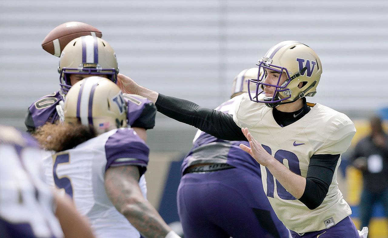 Washington quarterback Tony Rodriguez throws at the team’s annual spring preview college football event on April 23 in Seattle. Rodriguez is competing with K.J. Carta-Samuels to be the Huskies’ backup quarterback. (AP Photo/Elaine Thompson)