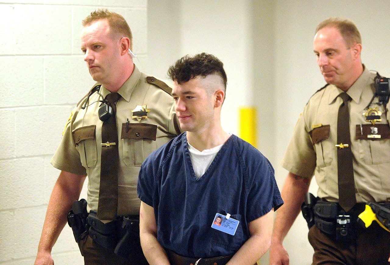 In this May 14, 2015 photo, Army Spc. Caleb Barnes is escorted to court for a preliminary hearing in Allentown, Pennsylvania. (Bill Adams /The Express-Times, file)