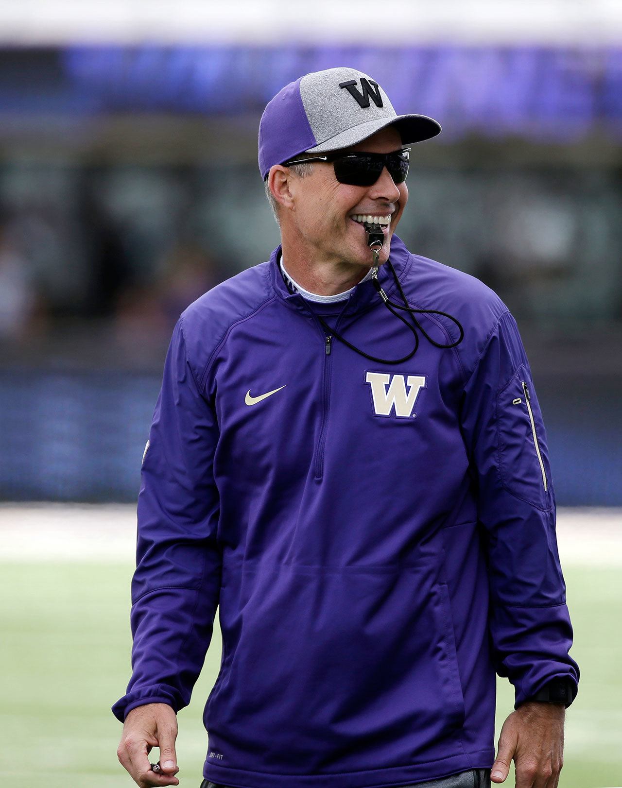 Washington coach Chris Petersen smiles during the team’s annual spring preview event on April 23 in Seattle. (AP Photo/Elaine Thompson)