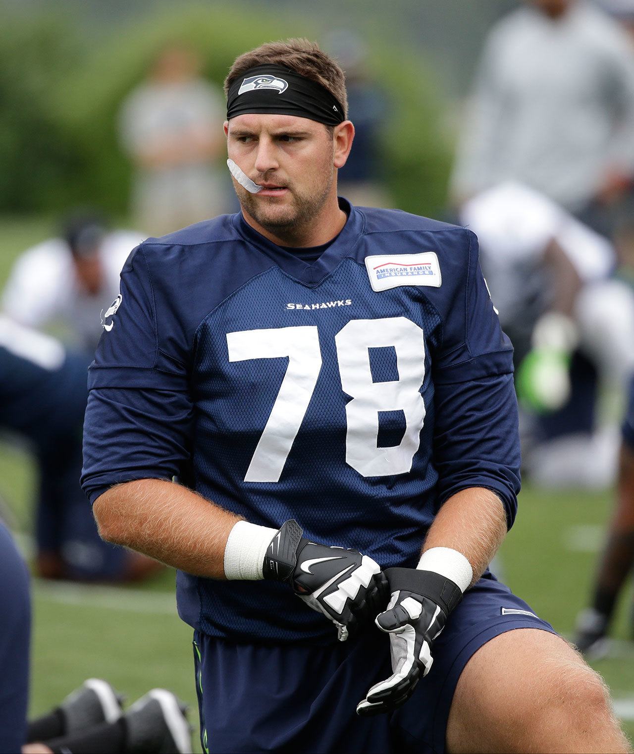Seahawks tackle Bradley Sowell stretches before a training-camp practice July 30 in Renton. (AP Photo/Elaine Thompson)
