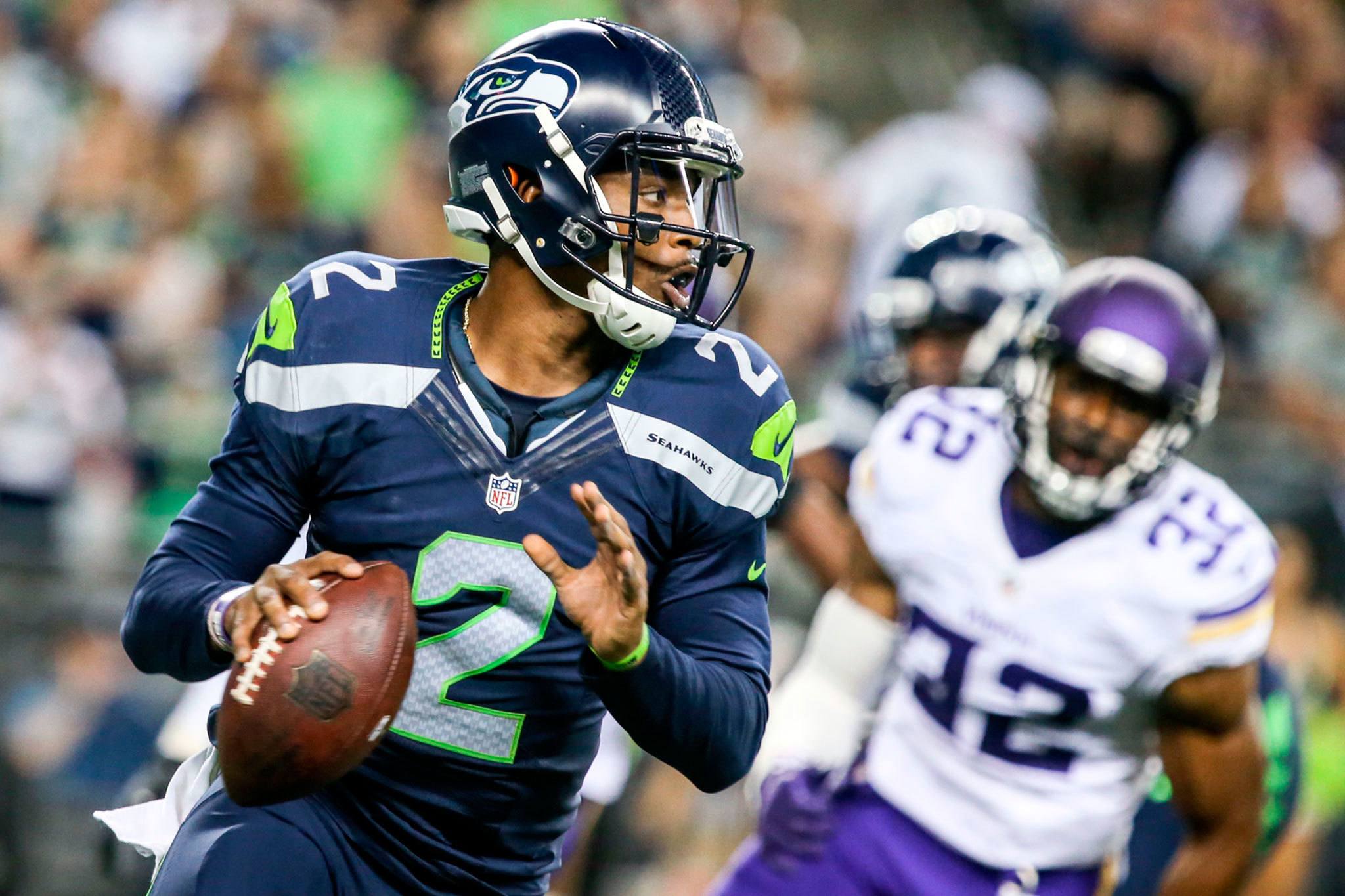 Seahawks Trevone Boykin looks to pass against the Minnesota Vikings Thursday night at Century Link Field in Seattle. (Kevin Clark / The Herald)