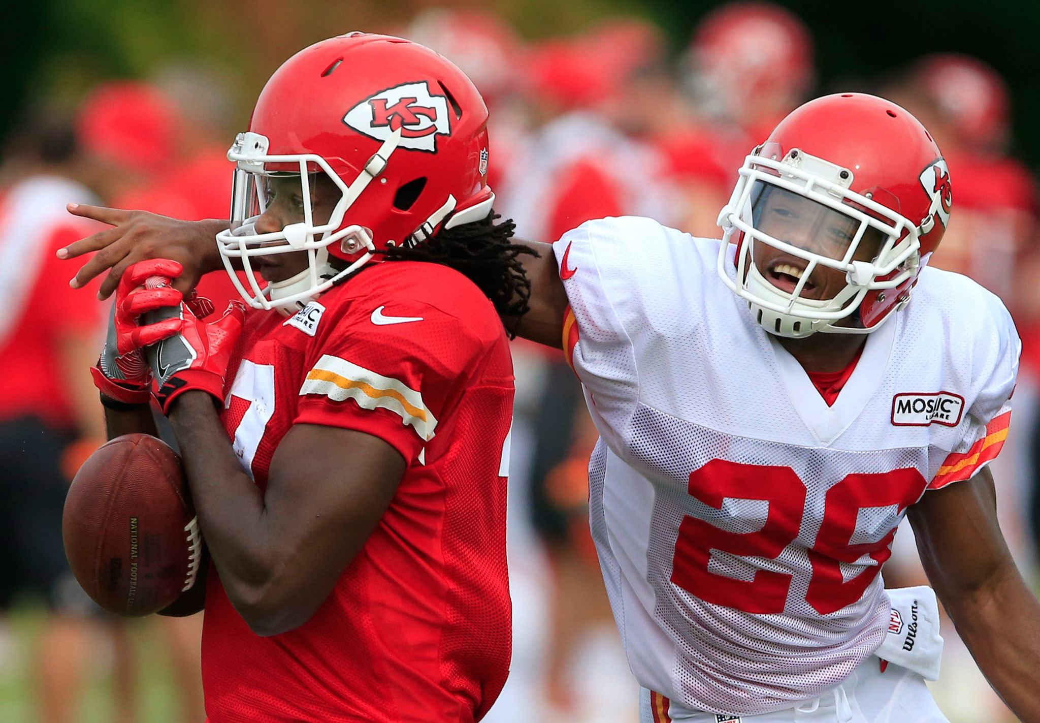 Chiefs cornerback KeiVarae Russell (26), a Mariner High School alum, reaches in to break up a pass intended for wide receiver Chris Conley during a practice Aug. 2 in St. Joseph, Mo. (AP Photo/Orlin Wagner)