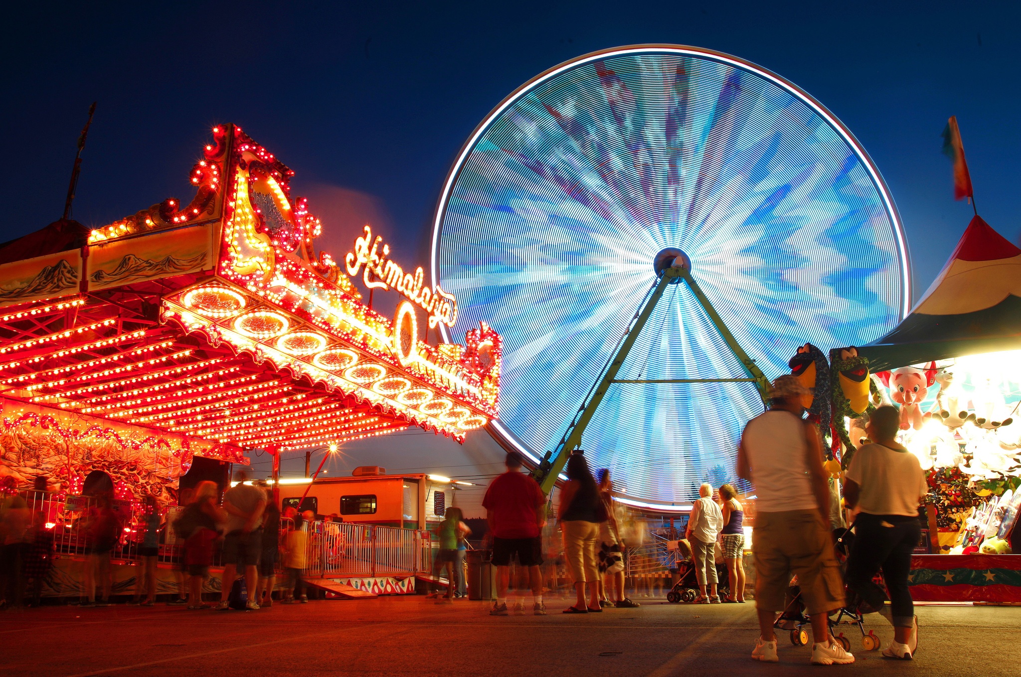 The Giant Wheel lights up the midway as it rotates at the Evergreen State Fair in 2011. (Mark Mulligan / Herald File)
