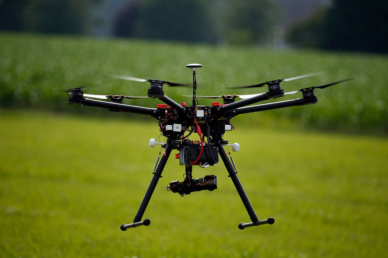 A hexacopter drone is flown during a drone demonstration at a farm and winery on potential use for board members of the National Corn Growers in Cordova, Maryland. (Associated Press)