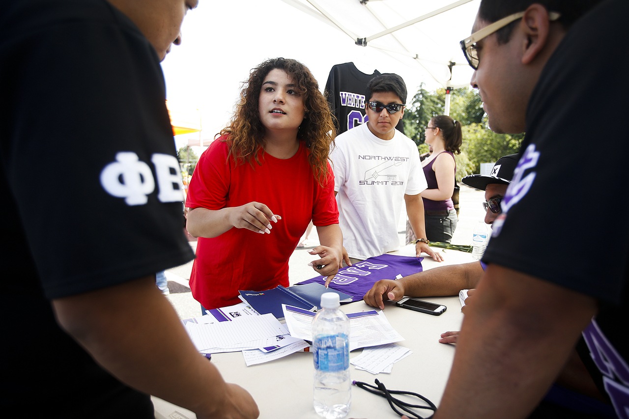 Karla Rios, of Everett, helps coordinate events scheduled during Edmonds Community College’s Latino Expo on Saturday, Aug. 13. Rios, who recently graduated from Washington State University, has been volunteering for four years with the Latino Educational Training Institute. (Ian Terry / The Herald)