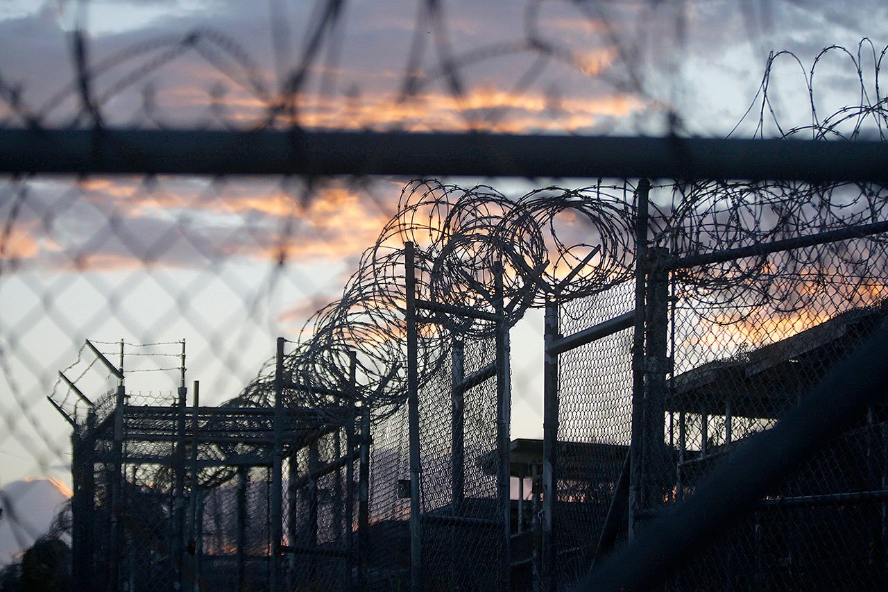 In this Nov. 21, 2013, photo reviewed by the U.S. military, dawn arrives at the now closed Camp X-Ray, which was used as the first detention facility for al-Qaida and Taliban militants who were captured after the Sept. 11 attacks, at the Guantanamo Bay Naval Base, Cuba. (AP Photo/Charles Dharapak, File)