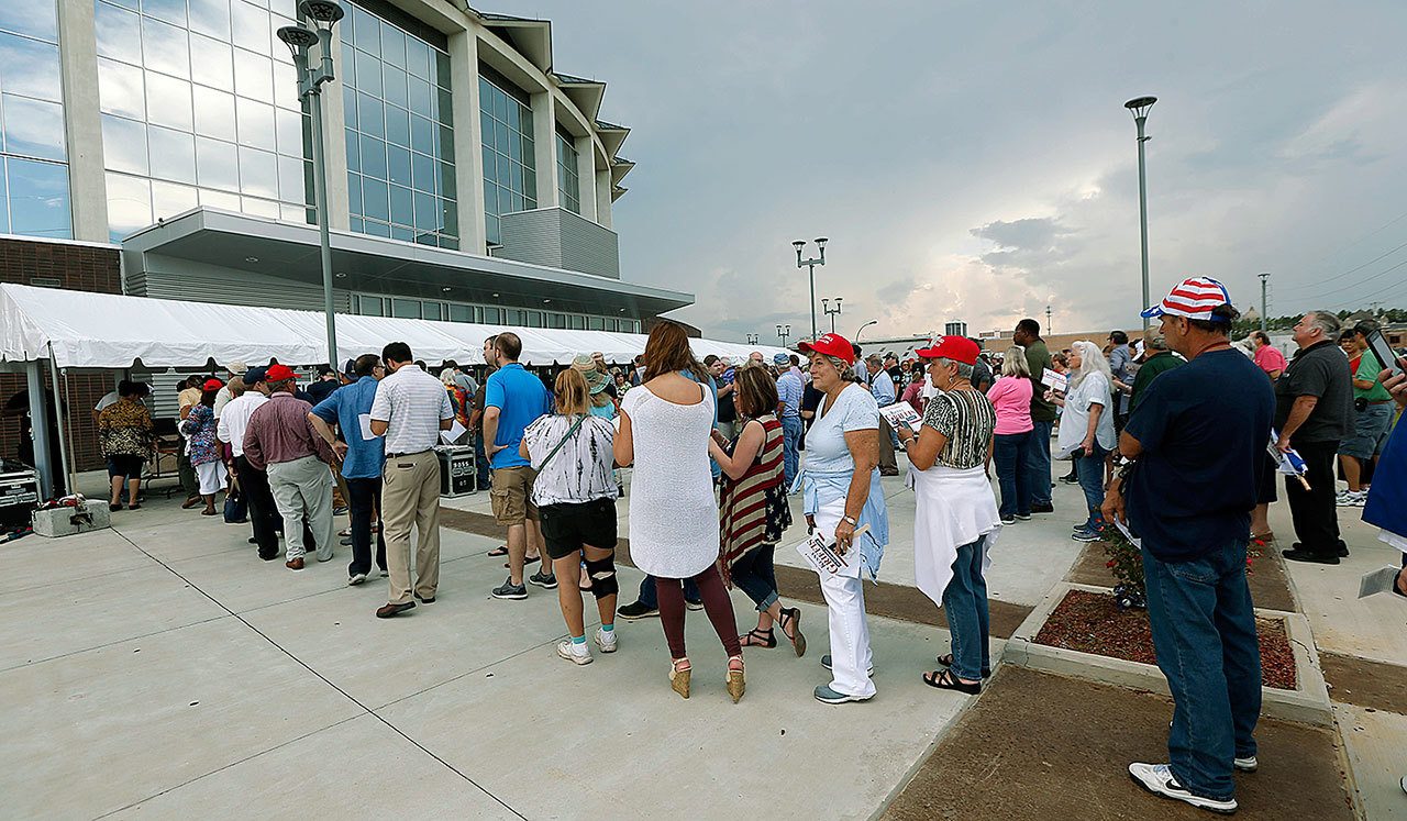 Supporters stand in line as they wait to enter the Mississippi Coliseum in Jackson for a rally for Republican presidential candidate Donald Trump on Wednesday. (AP Photo/Rogelio V. Solis)