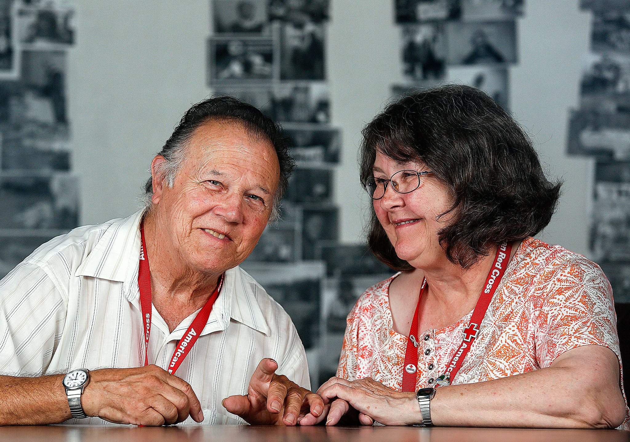 The gentle nature of Richard and Kathy Kennard shows through, even as the couple sits down for a photo recently at the Snohomish County Chapter of the American Red Cross in Everett. The Kennards team up to help people, often in the middle of the night following emergency calls. (Dan Bates / The Herald)