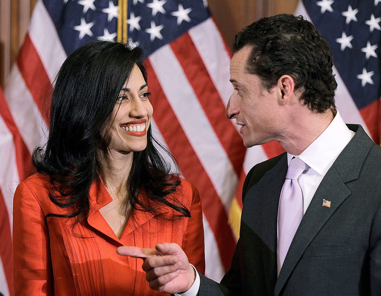 In this photo taken Jan. 5, 2011, then-New York Rep. Anthony Weiner and his wife, Huma Abedin, an aide to then-Secretary of State Hillary Clinton, are pictured after a ceremonial swearing in of the 112th Congress on Capitol Hill in Washington. Democratic presidential candidate Hillary Clinton aide Huma Abedin says she is separating from husband Anthony Weiner after another sexting revelation involving the former congressman from New York. (AP Photo/Charles Dharapak)