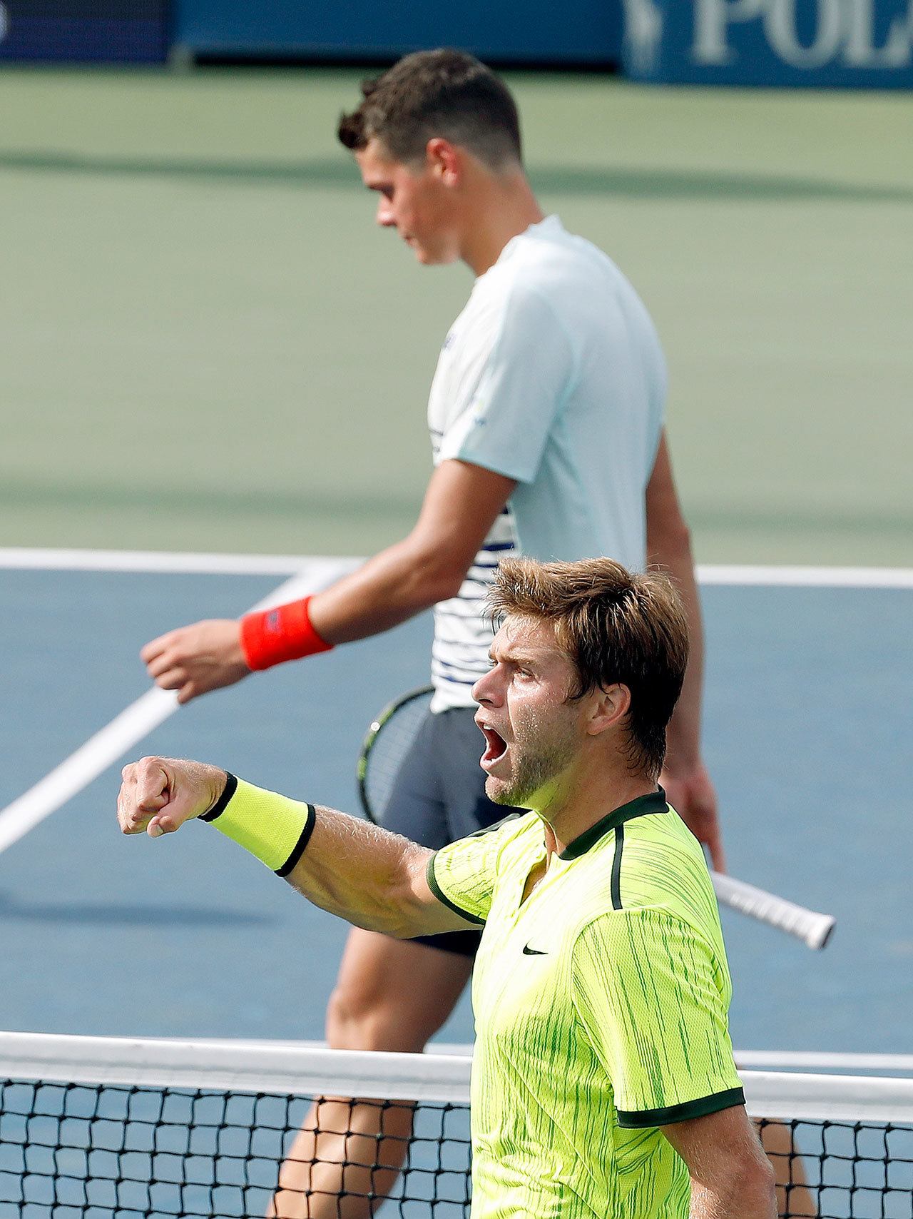 Ryan Harrison celebrates after winning a game against Milos Raonic during the second round of the U.S. Open on Wednesday in New York. Harrison went on to stun the fifth-seeded Raonic in four sets. (AP Photo/Alex Brandon)