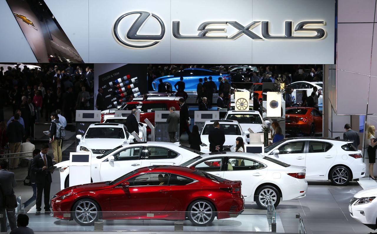 Attendees browse through the Lexus exhibit at the North American International Auto Show in Detroit in 2014.