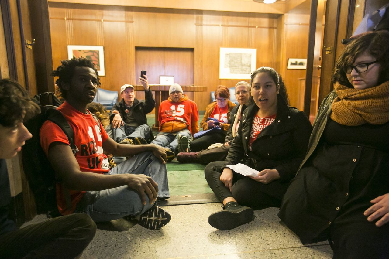 Protestors chant about low wages and high rents during a sit in at the Oregon governor’s office in Salem on Thursday.