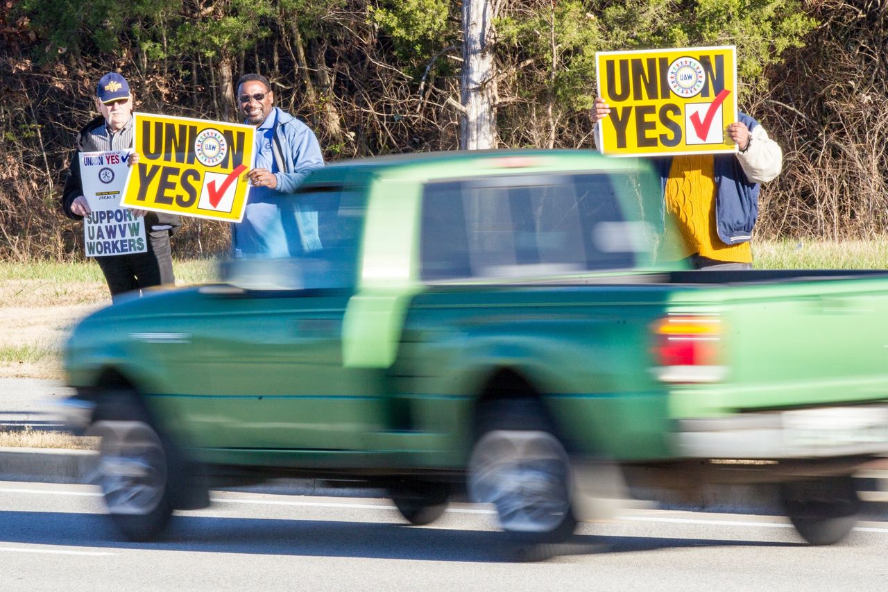 Union supporters hold up signs near the Volkswagen plant in Chattanooga, Tennessee, in 2015.