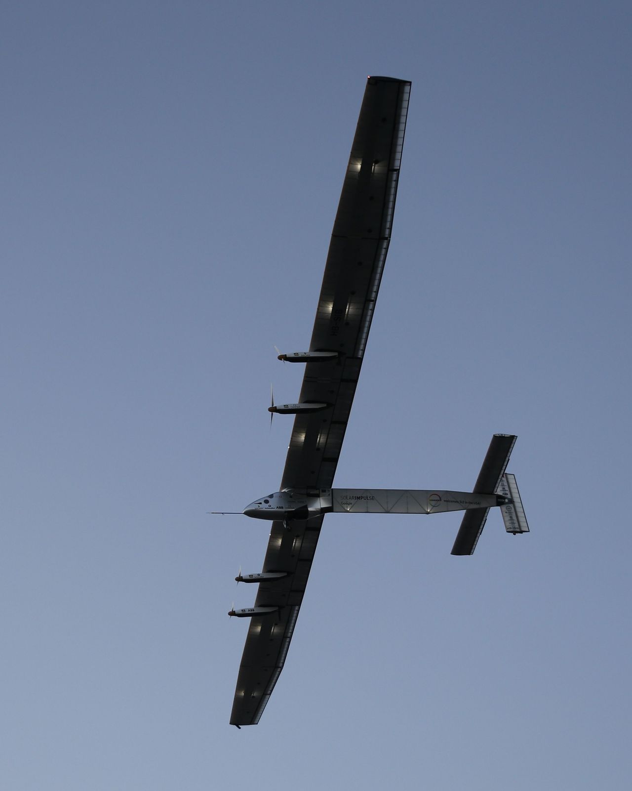 The Solar Impulse 2 solar plane flies out of Kalaeloa Airport on Thursday in Kapolei, Hawaii.