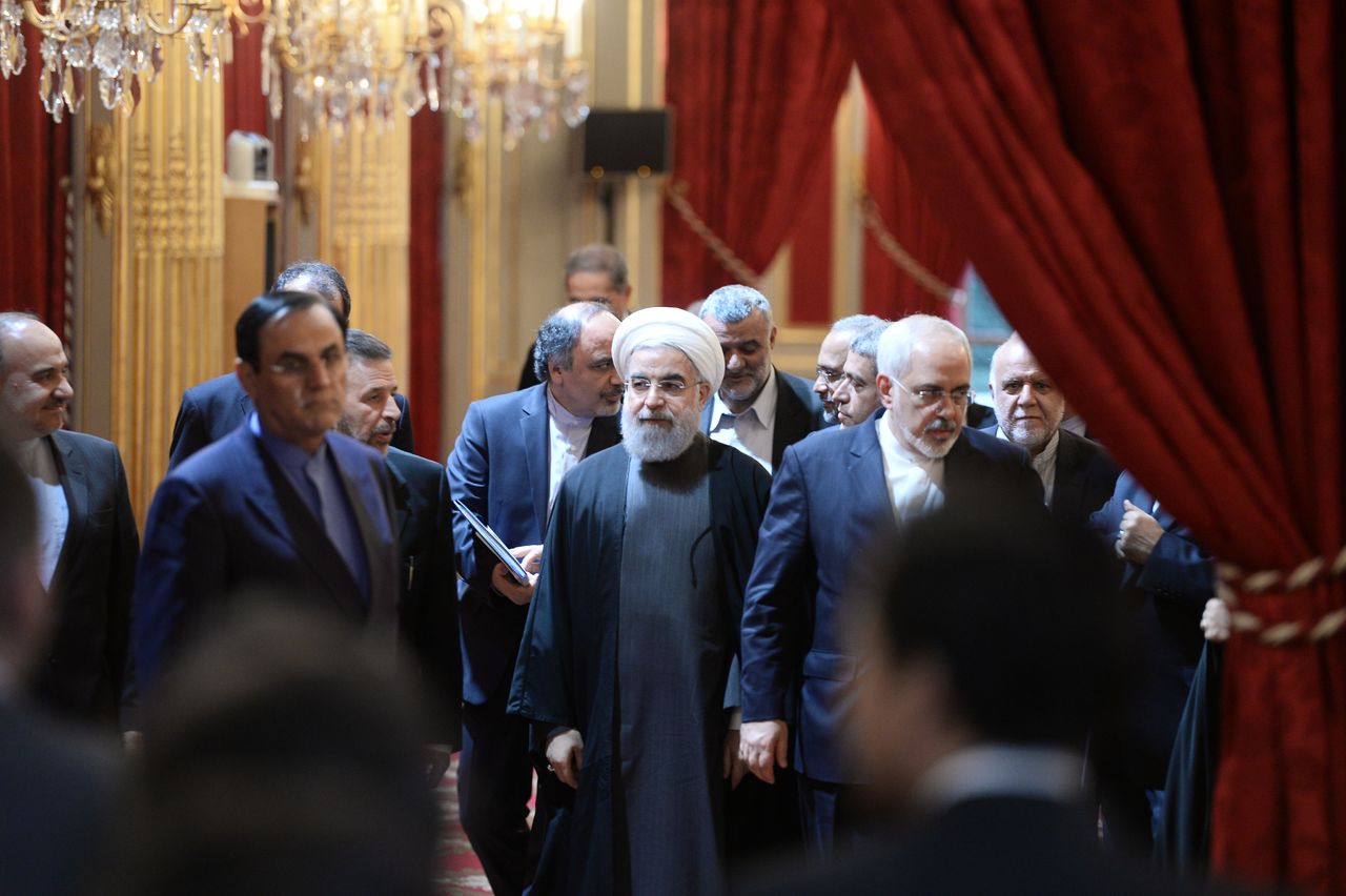 Iranian President Hassan Rouhani, (center) and Iranian Foreign Minister Mohammad Javad Zarif (right) arrive for the signature of bilateral agreements,at the Elysee Palace in Paris on Thursday. Iran Air has signed a deal to buy 118 aircraft from Airbus in the first of an expected host of commercial deals expected to be announced during the visit of Iranian President Hassan Rouhani to Paris.