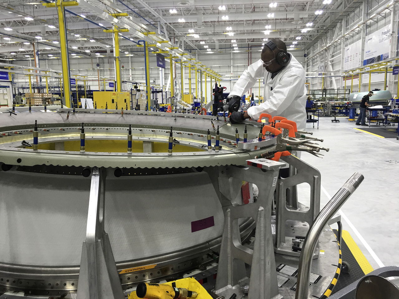 Boeing mechanic Robert Myers drills holes and installs bolts through a titanium piece for a 737 MAX engine inlet Wednesday. Boeing Propulsion South Carolina designed and produces the inlets in Ladson, an area just north of the company’s North Charleston plant.