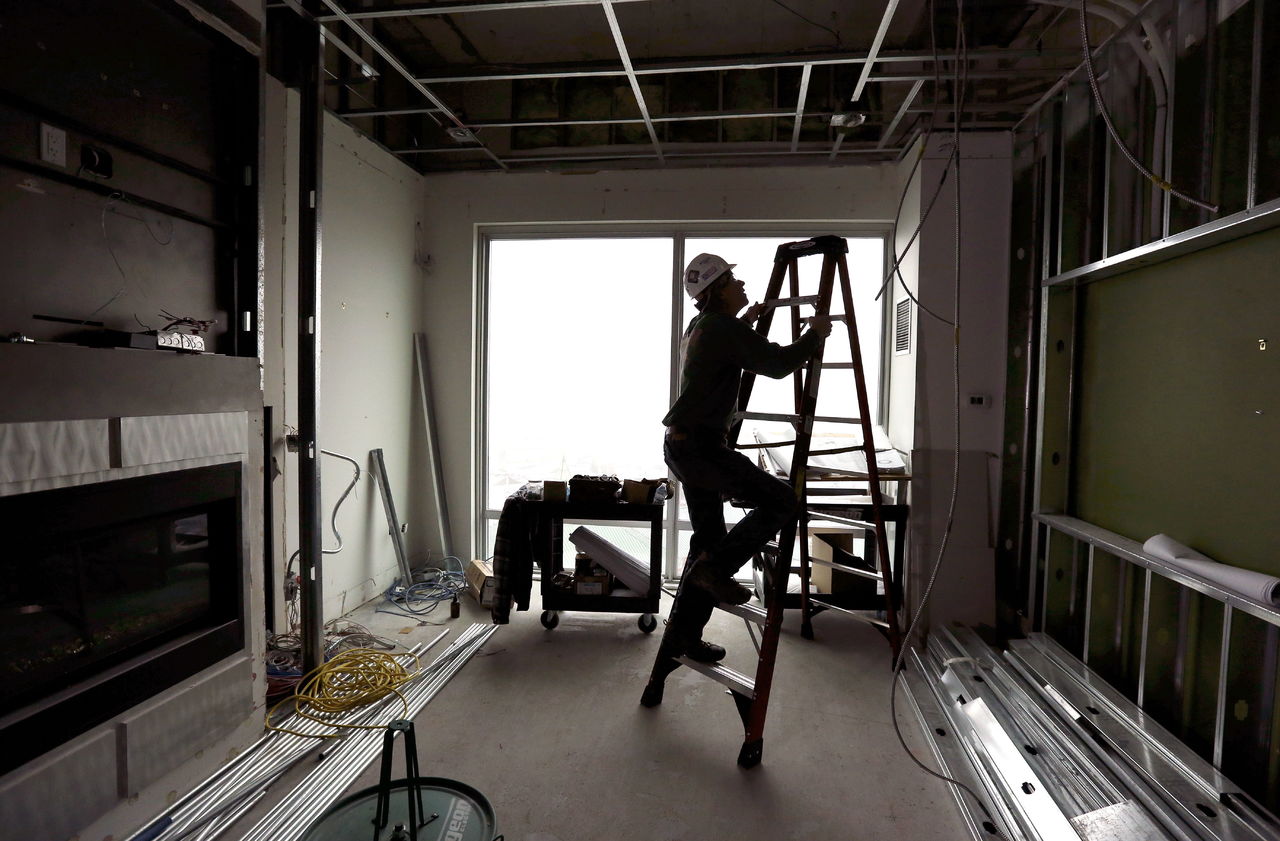 Electrician Todd Byfield heads up a ladder to install lighting at Tulalip Resort Casino on Monday in Tulalip. National developer Kitchell is renovating 360 rooms and building a “mega-suite” at the resort. Construction will occur so that 70 percent of the hotel rooms will be open at a time.