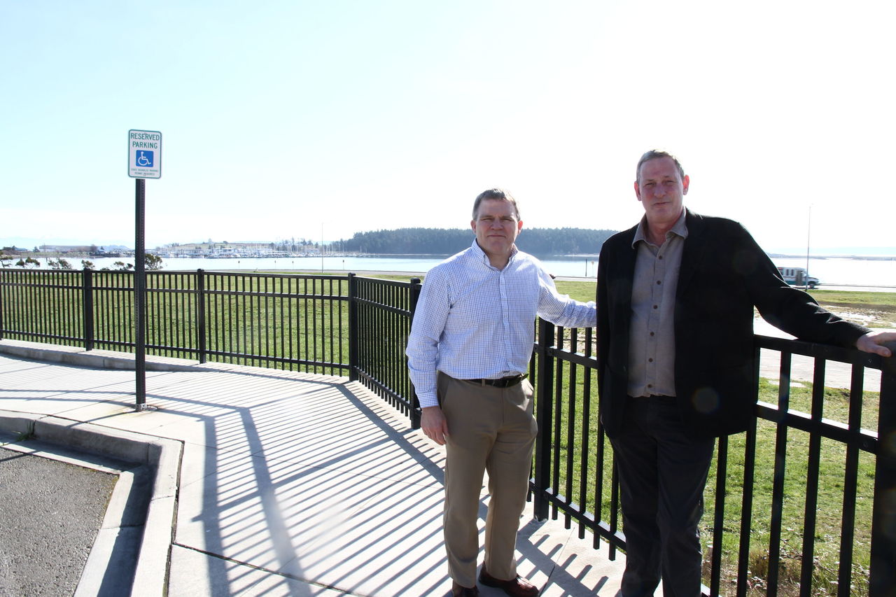 Jim Roe, of Roe Family Facilities (right), and Joe Sladich, the company’s community-development director, stand near where they and a partner propose building a 60,000-square-foot mixed-use rehabilitation center.