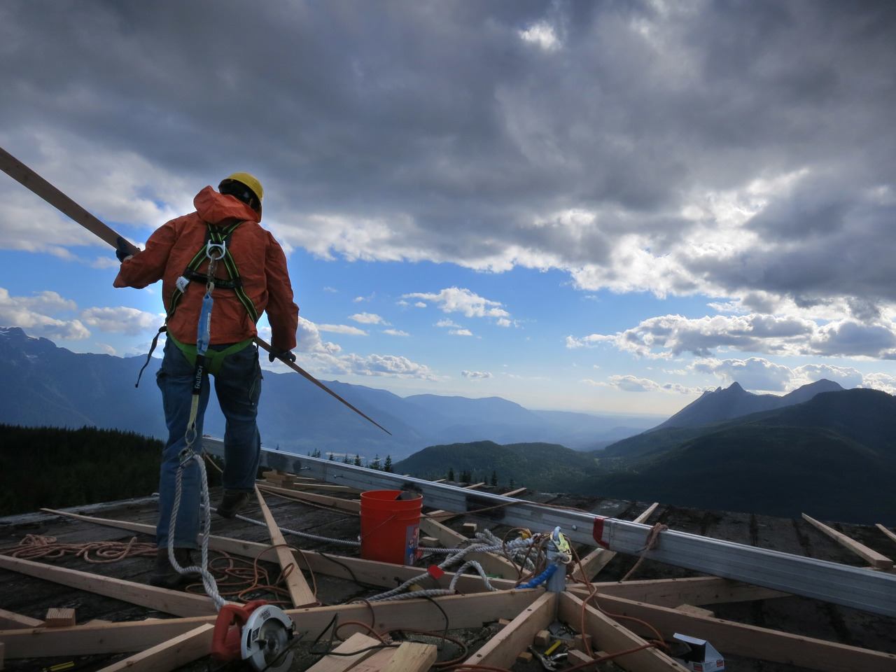 Gavin Gladsjo works on the roof of the North Mountain Lookout last year.