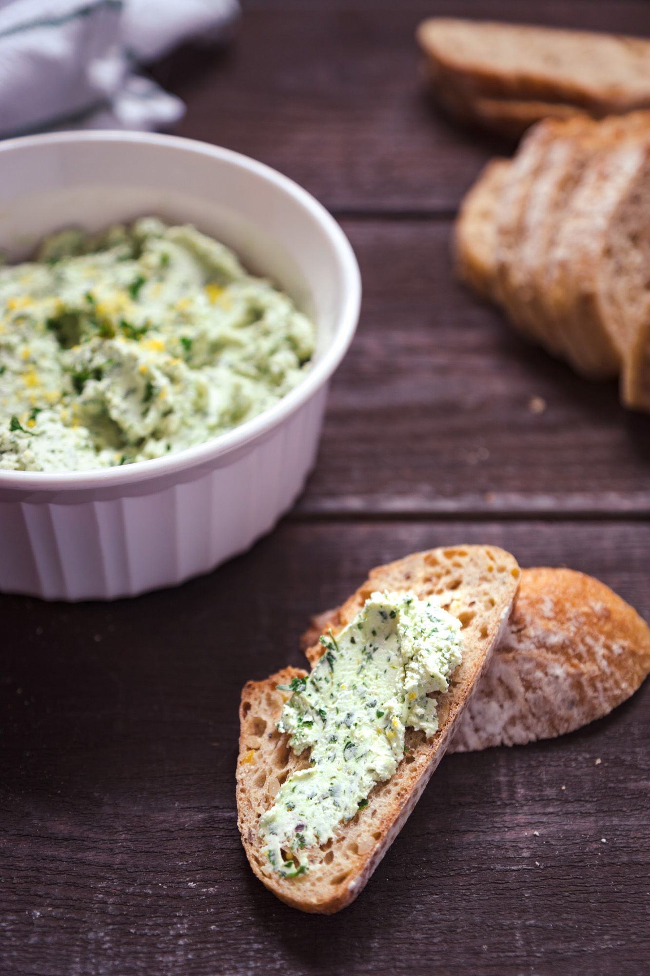 Lemon-herb goat cheese spread is excellent on bread as a light appetizer.