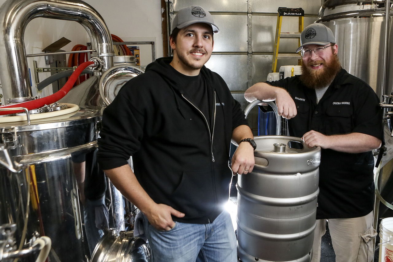 Dick Mergens (left) and Shawn Dowling of Crucible Brewing plan a beer-naming party Saturday at the brewery in south Everett.