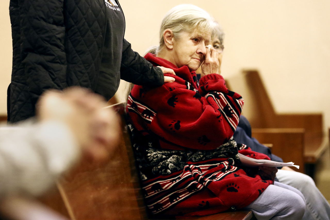 “Mother Mary” Spafford grieves during the memorial service for Rudy Van Delden Thursday night at Our Lady of Perpetual Help Catholic Church in Everett.