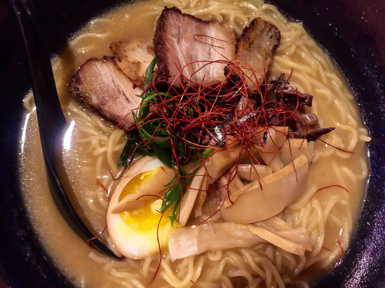 Noodles and pork are among the wonders in a bowl of spicy ramen at J Ramen & Sushi.