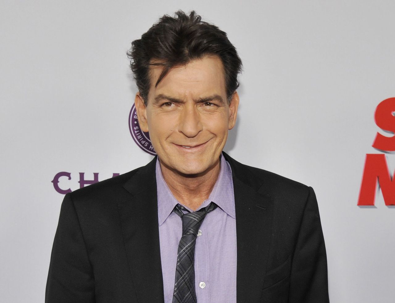 In this April 11, 2013, photo, Charlie Sheen, a cast member in “Scary Movie V,” poses at the Los Angeles premiere of the film at the Cinerama Dome in Los Angeles.