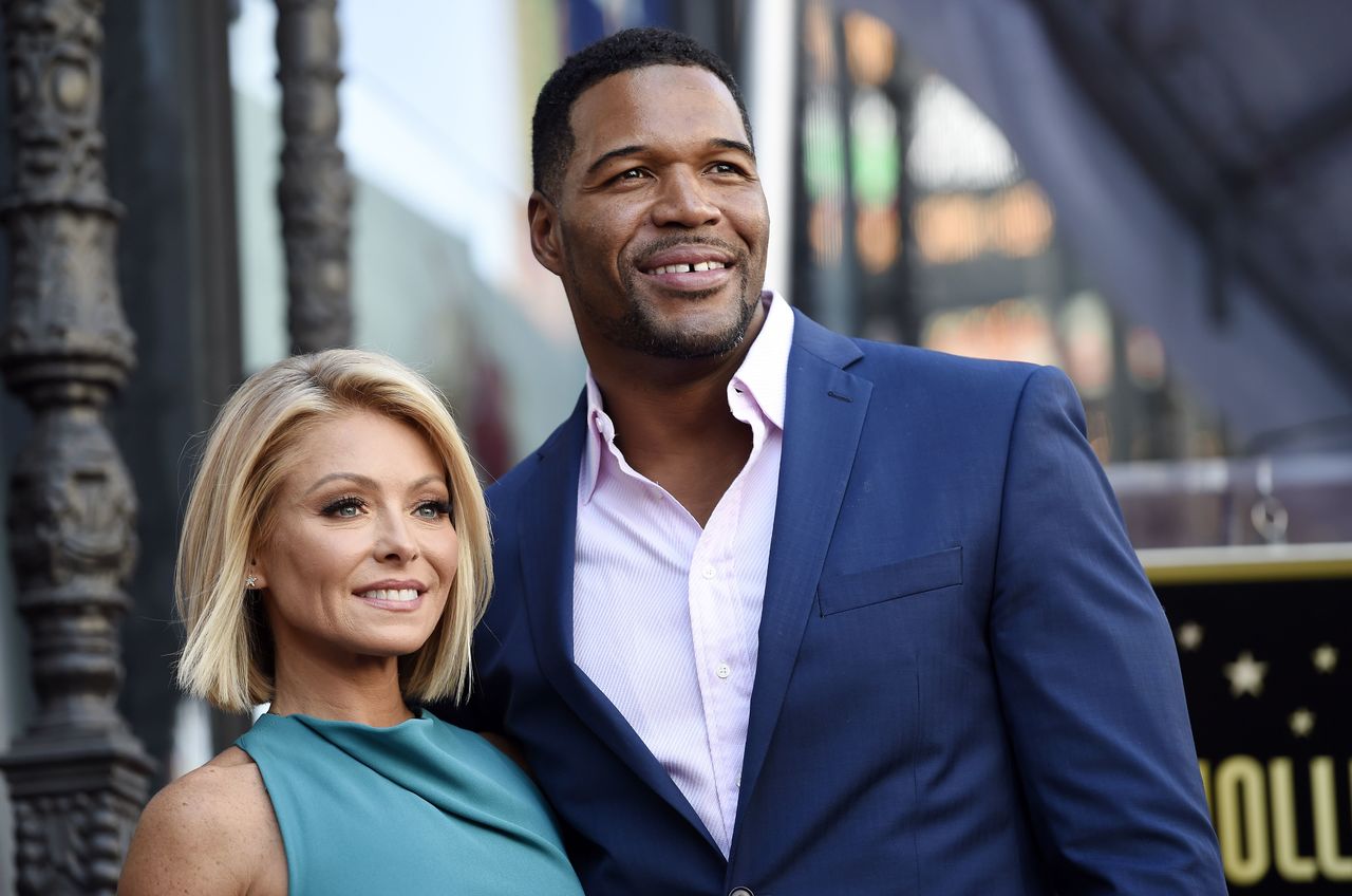 Kelly Ripa returned as co-host of her morning talk show after a four-day absence after ABC announced Tuesday that co-host Michael Strahan (right) will leave the show to join “Good Morning America” full-time.