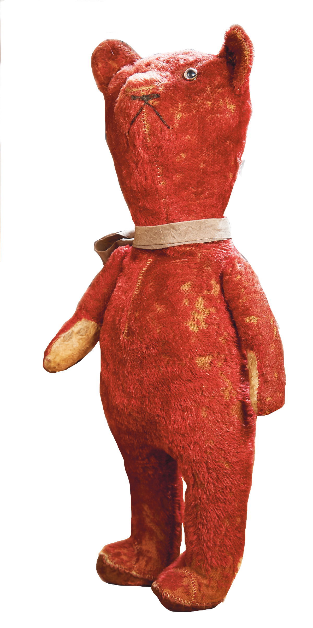 This 22-inch-tall red Teddy bear was sold at a Theriault auction for $448 in 2014. The vintage bear has small electric bulbs for eyes that no longer work.