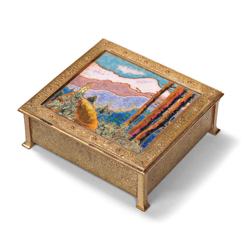 The landscape on this bronze box is enamel made from melted glass, an art form revived in the United States in the late 1930s. According to the mark on the bottom, it was made by the A. Douglas Nash Corporation. It auctioned for $1,353, well over estimate.