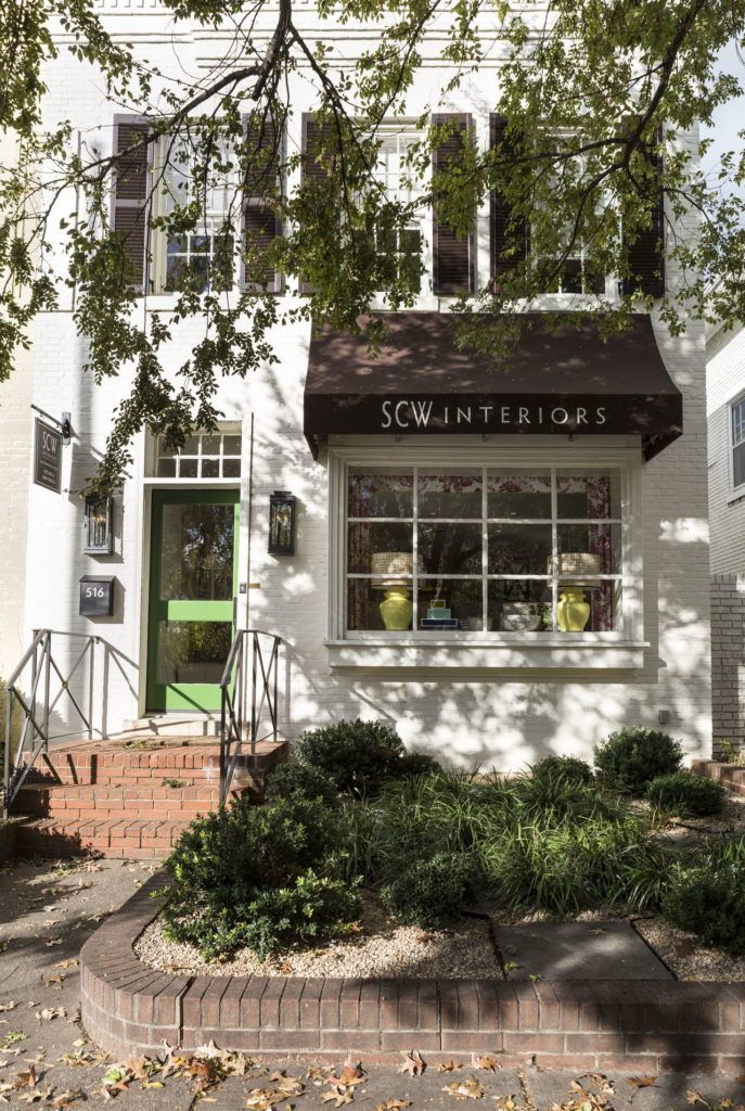 The front door of this design studio is painted Basil Green by Benjamin Moore.
