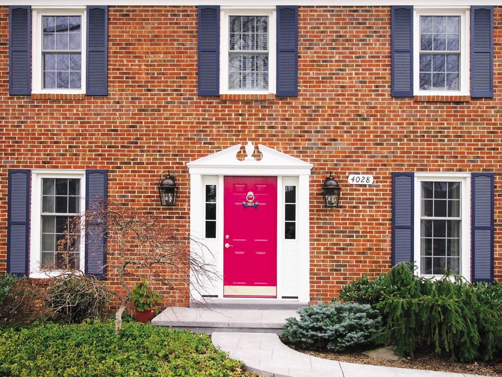 Designer Stuart Nordin selected Magenta by Benjamin Moore as his front door color.